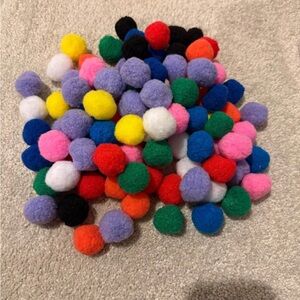 Set of 99 colorful Pom poms.